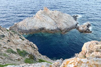 High angle view of rock formation in sea