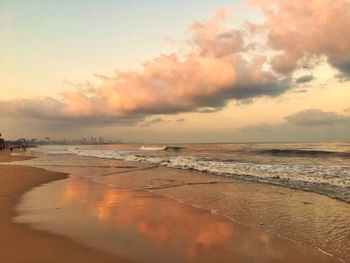 Scenic view of beach against sky during sunset