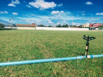 View of field against built structure