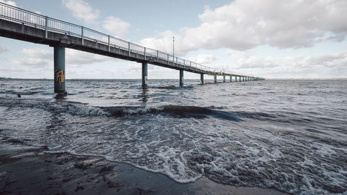 View of suspension bridge over sea