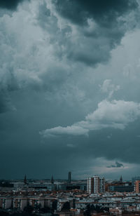 Buildings in city against sky