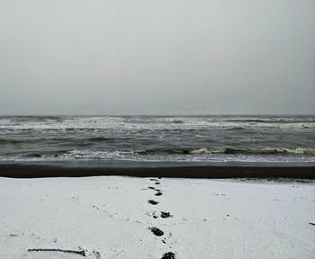 Scenic view of beach against clear sky