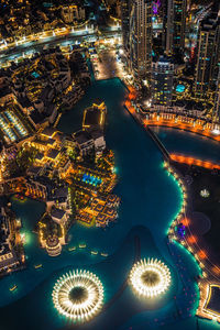 High angle view of illuminated city buildings at night