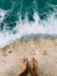 Low section of person on beach