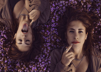 Portrait of beautiful woman with purple flowers