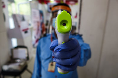 Close-up of man holding camera