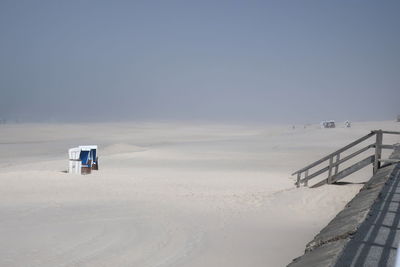 Lifeguard hut on beach against clear sky, sylt