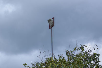 Low angle view of street light against sky