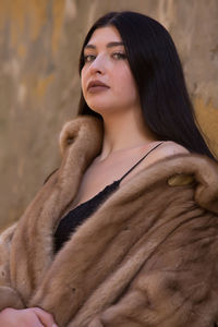 Portrait of a young woman looking away