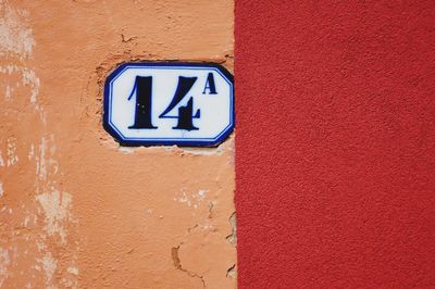 Close-up of information sign on wall