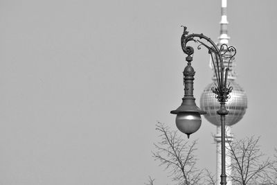 Street light and fernsehturm against clear sky