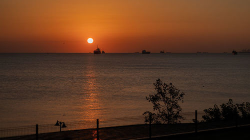 Scenic view of sea against sky during sunset