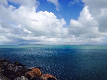 Scenic view of sea against cloudy sky