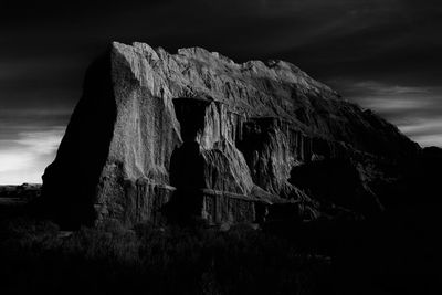 Low angle view of rock formation against sky