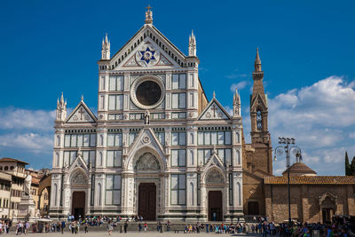 Tourists at the basilica of the holy cross in florence