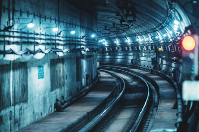 Illuminated tunnel at subway station