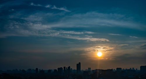 Cityscape against sky during sunset