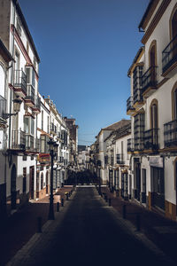 Narrow street amidst buildings in town