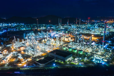 High angle view of illuminated buildings in city at night