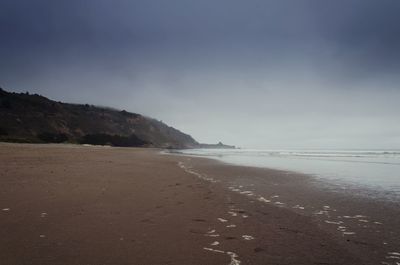 Scenic view of beach against sky