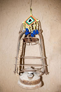 Close-up of bell hanging against wall