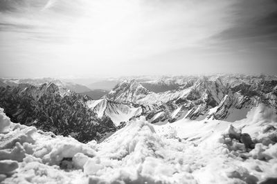 Scenic view of snowcapped mountains against sky