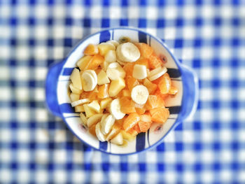 Directly above shot of sliced orange and banana in bowl