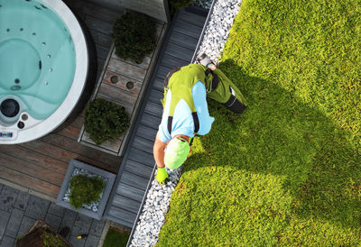 High angle view of woman standing on grassy field