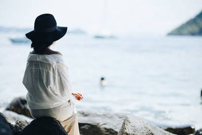 Rear view of woman looking at sea