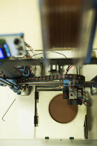 High angle view of 3d printer on table at office