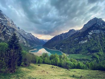 Scenic view of landscape and mountains against sky