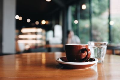 Close-up of coffee served on table at cafe