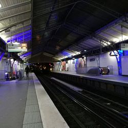 Illuminated railroad station at night