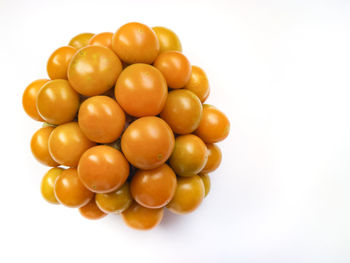 High angle view of tomatoes over white background