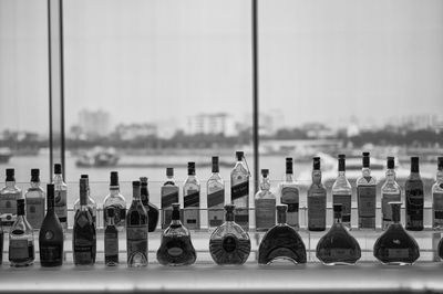 Empty alcohol bottles on window sill