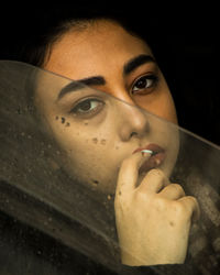 Close-up portrait of young woman in car