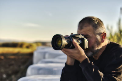 Man photographing with camera