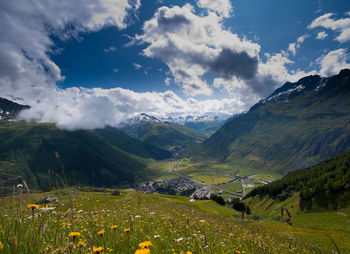 Scenic view of landscape and mountains against sky