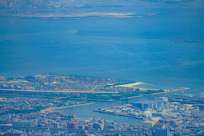 Aerial view of cityscape by sea