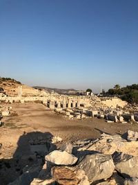 View of stone wall against clear blue sky