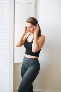 Young woman exercising in gym