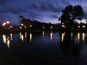 Scenic view of lake against sky at night