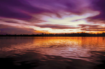 Scenic view of lake against romantic sky at sunset