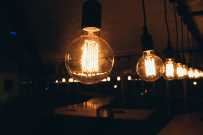 Illuminated light bulbs at night