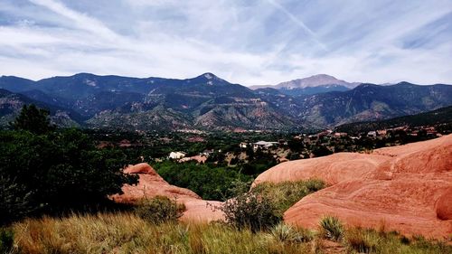 Scenic view of landscape and mountains against sky
