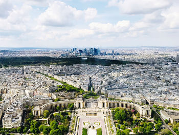 High angle view of city buildings against cloudy sky from eiffel tower 