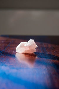 Close-up of broken glass on table