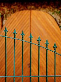 Close-up of metal fence on field