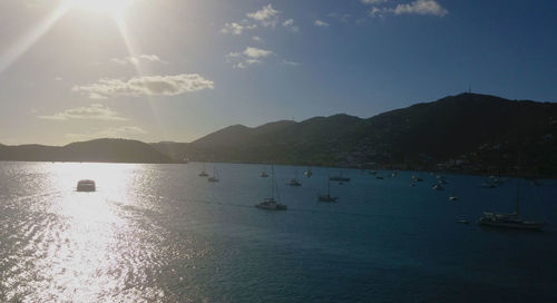 Scenic view of sea with mountains in background