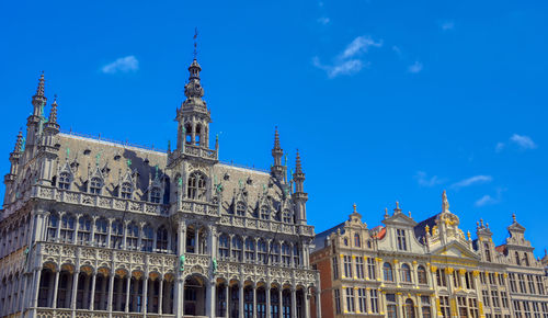 Low angle view of building against blue sky